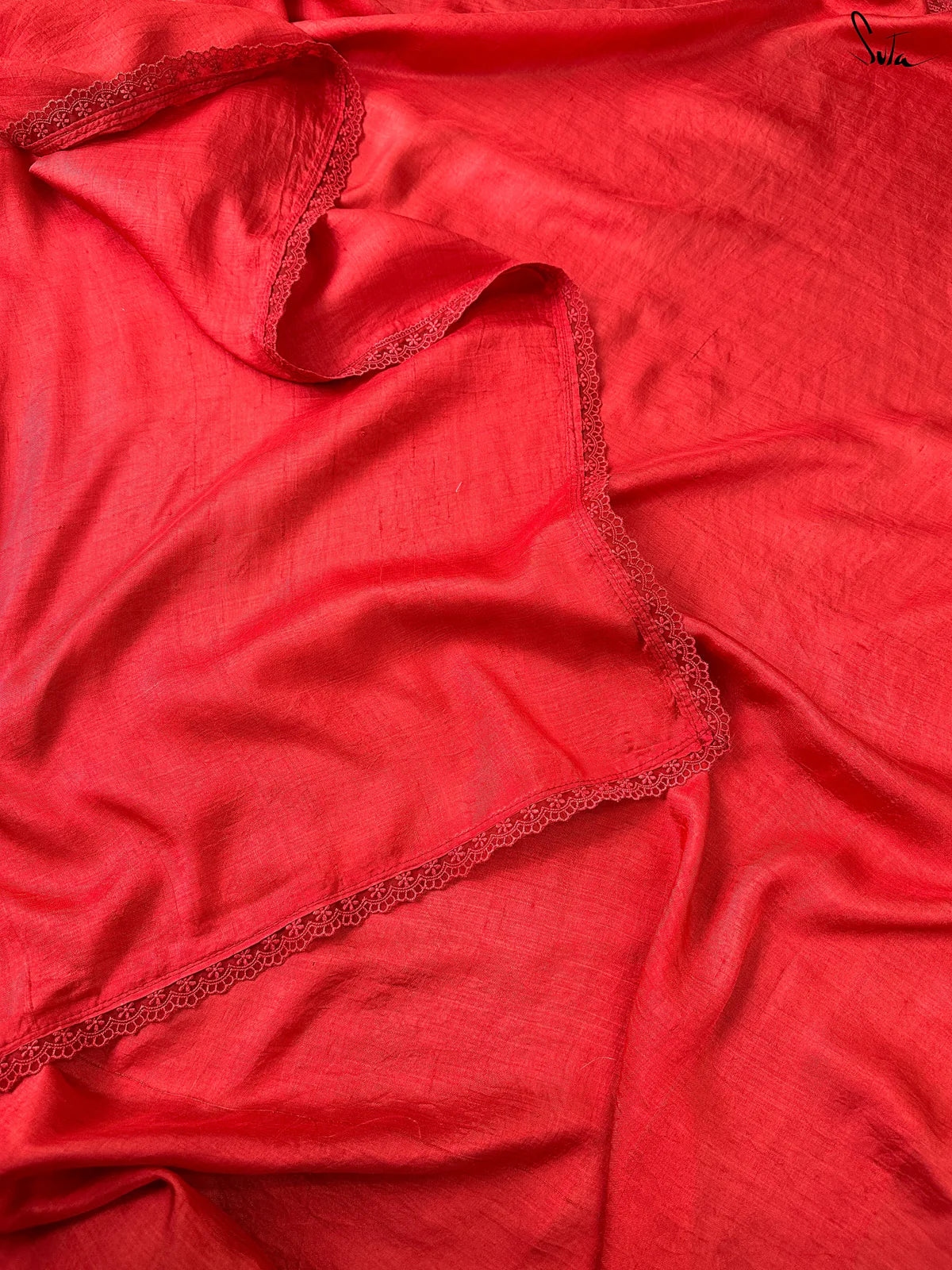 Red silk saree close up with lace trim