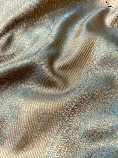 Close-up of textured fabric with intricate patterns and colors.