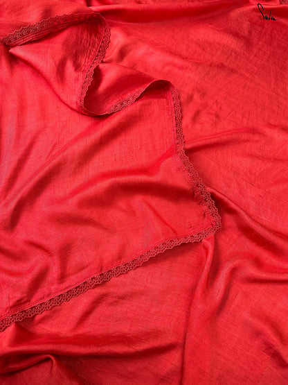 Red silk saree close up with lace trim 