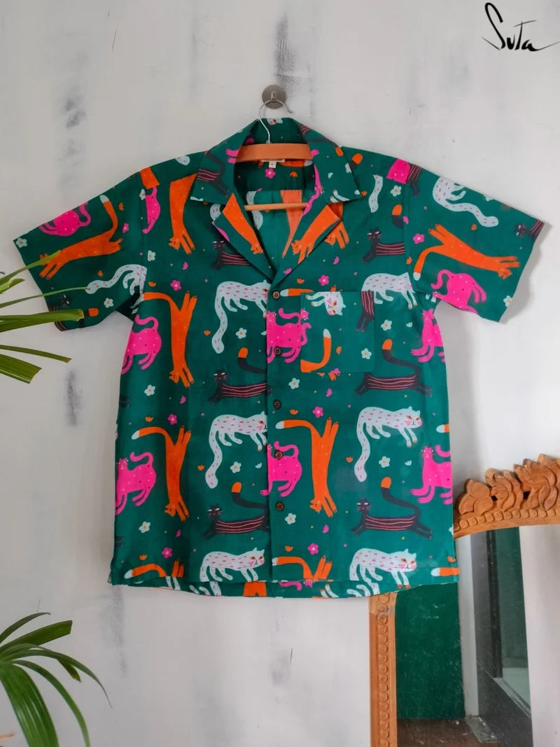 Colorful patterned shirt with animals on a white background